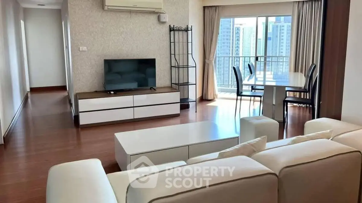 Spacious modern living room with city view and elegant dining area.