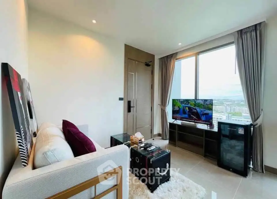 Modern living room with city view, stylish decor, and large window for natural light.