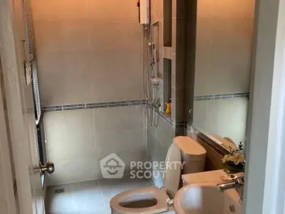 Modern bathroom with sleek fixtures and neutral tiles