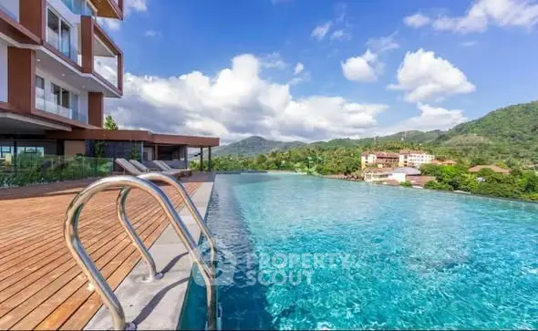 Luxurious infinity pool with stunning mountain views at modern residential complex.