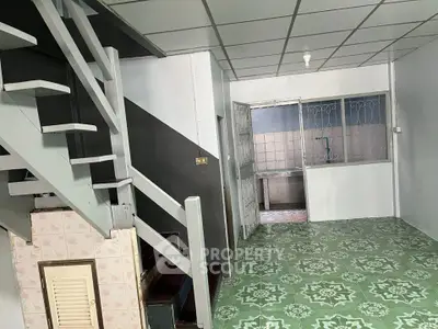 Charming interior with unique staircase and vintage tile flooring