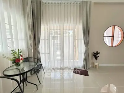 Elegant living room with floor-to-ceiling windows and stylish decor