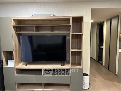 Modern living room with sleek wooden TV unit and contemporary decor