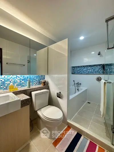 Modern bathroom with stylish mosaic tiles and sleek fixtures