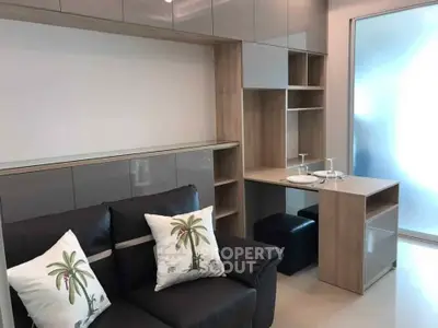 Modern living room with sleek cabinetry and cozy seating, perfect for urban living.