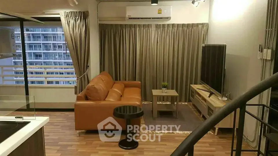 Modern living room with leather sofa and large TV in a stylish apartment