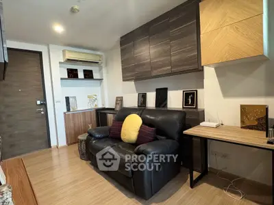Modern living room with stylish decor and comfortable seating in a cozy apartment.