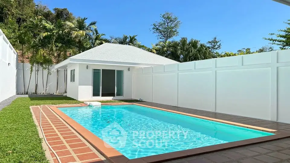 Stunning villa with private pool and lush garden, perfect for luxury living and relaxation.