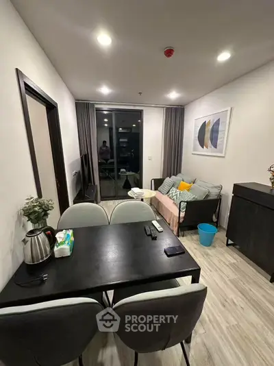 Modern living room with stylish decor and cozy seating area, perfect for relaxation and entertainment.