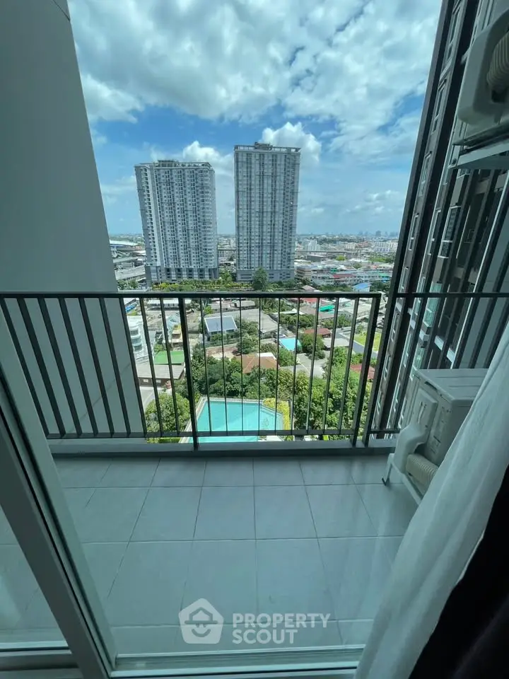Stunning high-rise balcony view with cityscape and pool
