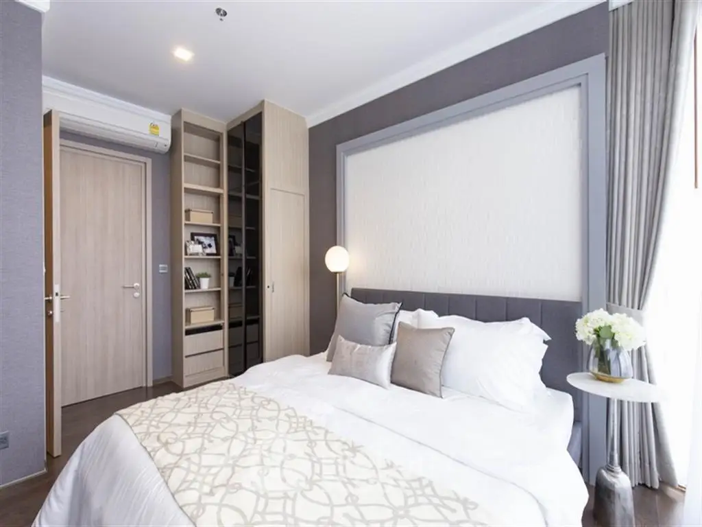 Luxurious bedroom with elegant decor and ample natural light