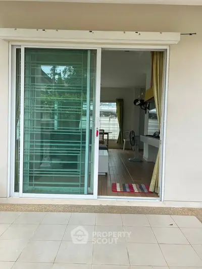 Spacious living room with sliding glass doors and modern decor
