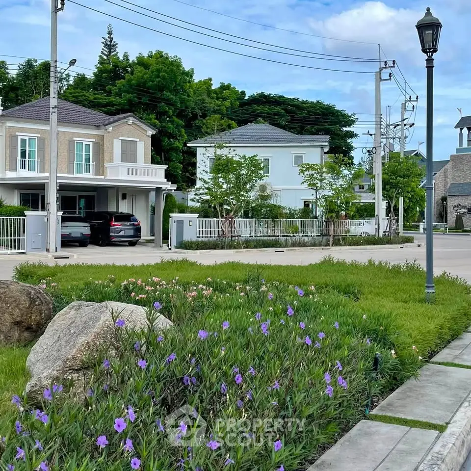 Charming suburban neighborhood with modern houses and lush greenery, perfect for family living.