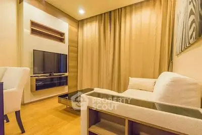 Cozy living room with modern decor and wall-mounted TV