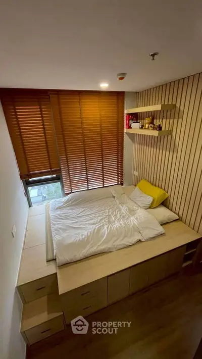 Cozy bedroom with wooden blinds and built-in storage bed