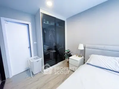 Modern bedroom with sleek wardrobe and cozy decor