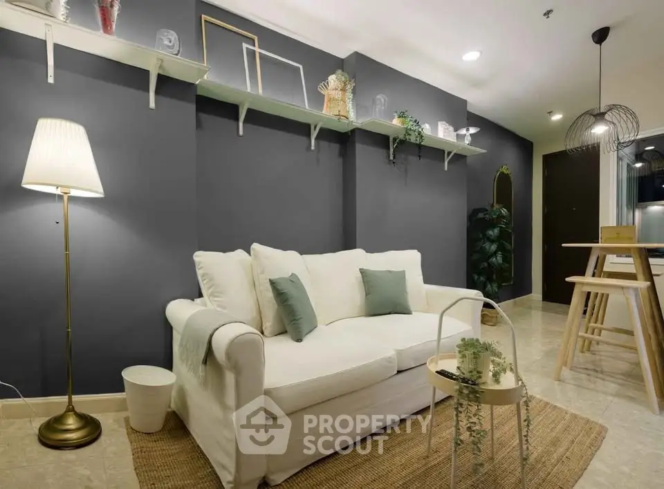 Modern living room with cozy white sofa and stylish decor
