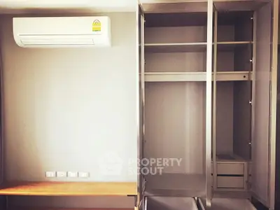 Modern interior with air conditioning and built-in wardrobe