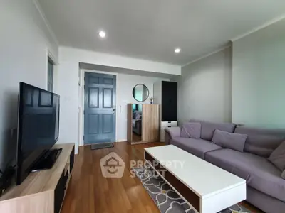 Modern living room with stylish furniture and wooden flooring