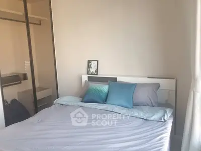 Cozy bedroom with modern decor and ample natural light
