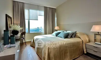 Luxurious bedroom with city view, elegant decor, and ample natural light.