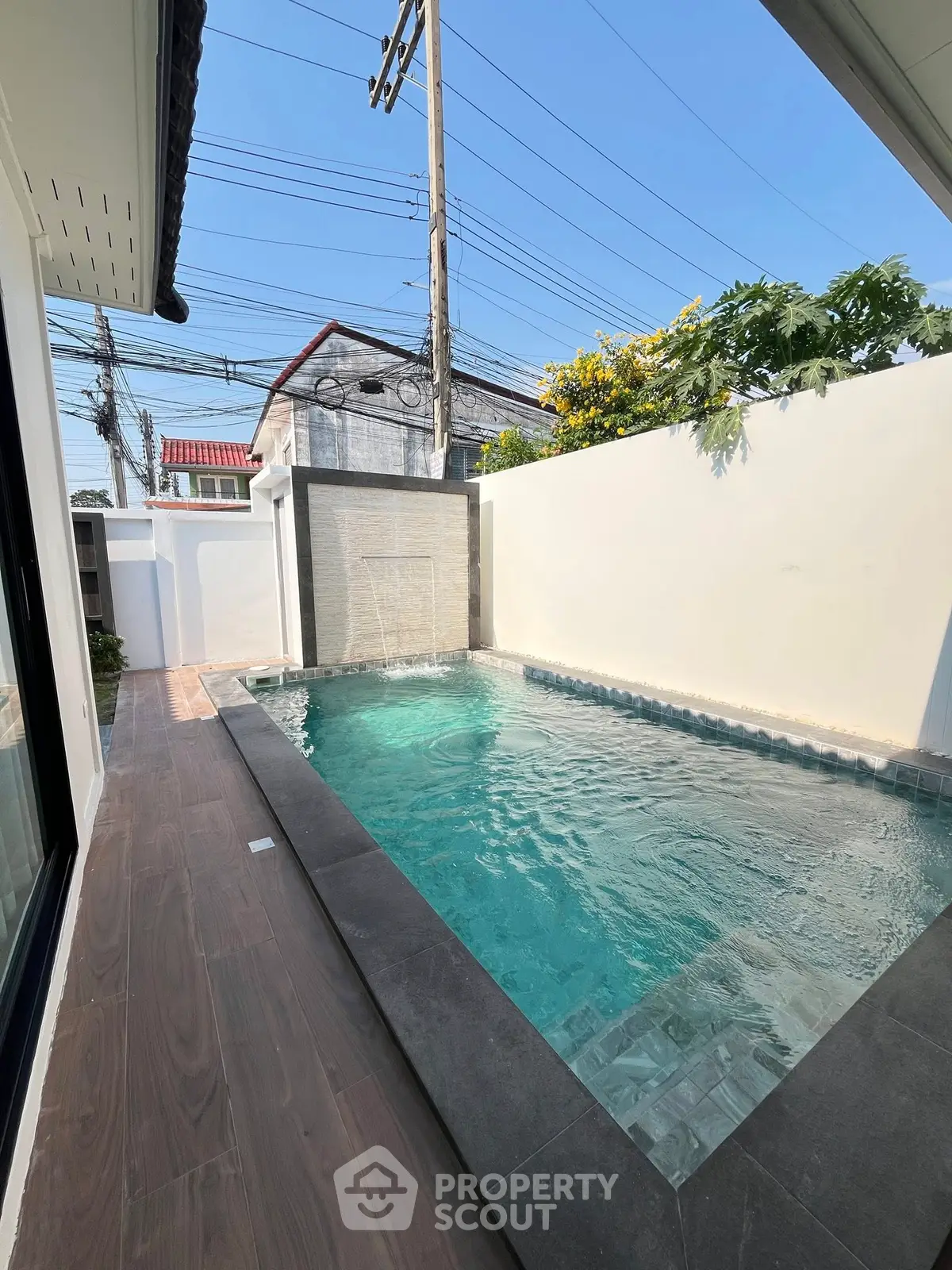 Charming private pool area with modern design and serene ambiance, perfect for relaxation and entertainment.