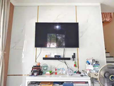 Modern living room with wall-mounted TV and stylish decor
