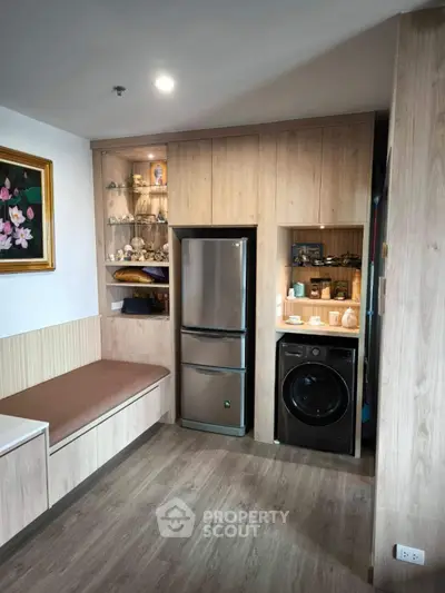 Modern kitchen with built-in appliances and cozy seating area