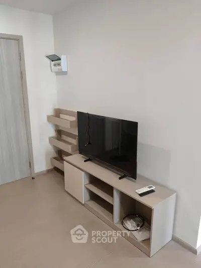 Modern living room with sleek TV stand and minimalist decor