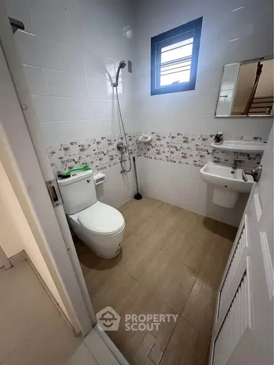Modern bathroom with sleek fixtures and stylish tile accents, perfect for contemporary living.