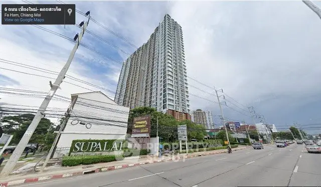 High-rise condominium building in Chiang Mai with street view and Supalai signage.