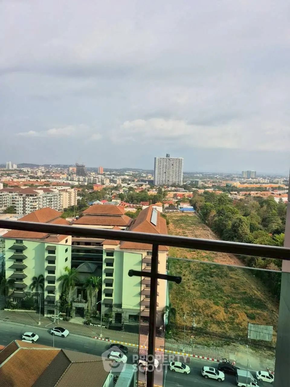 Stunning cityscape view from a high-rise balcony, showcasing urban living at its finest.