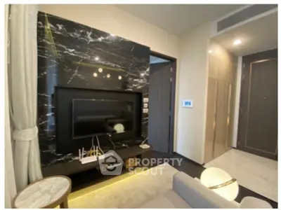 Luxurious modern living room with marble TV wall and elegant decor