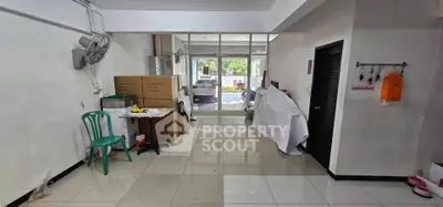 Spacious interior with tiled flooring and glass doors leading to outdoor area