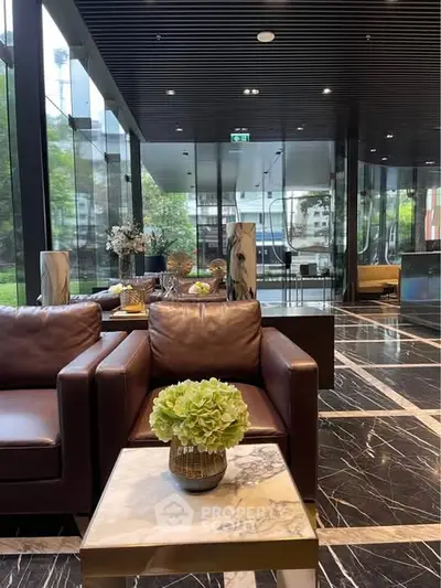 Luxurious modern lobby with leather seating and marble flooring