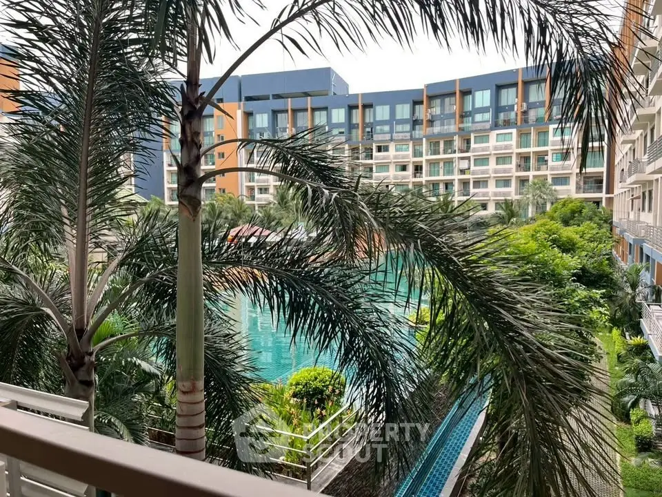 Luxurious apartment view with tropical pool and lush greenery