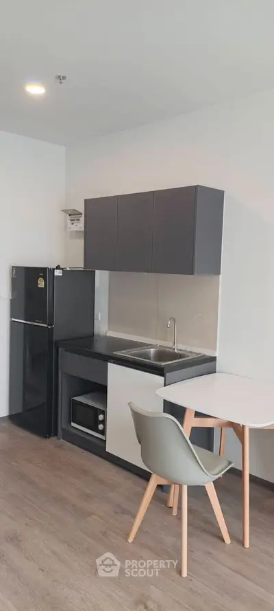 Modern kitchen with sleek design and open layout, featuring contemporary appliances and stylish cabinetry.