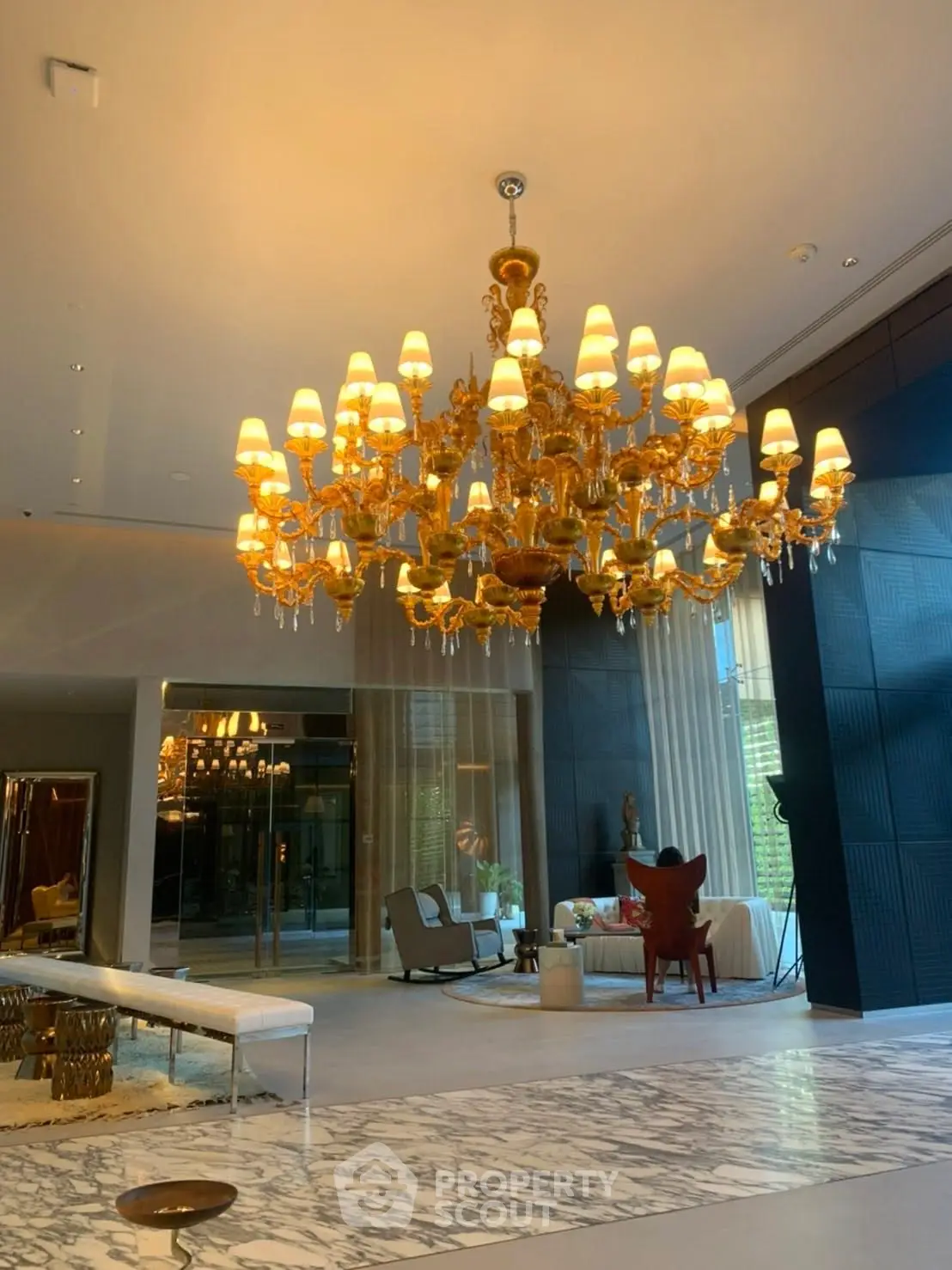 Luxurious living room with grand chandelier and elegant decor