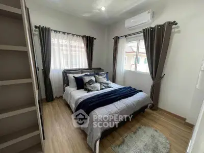 Cozy bedroom with modern decor and natural light