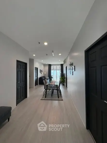 Spacious modern hallway with elegant decor and natural light