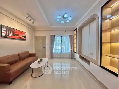 Spacious modern living room with elegant lighting and stylish furniture