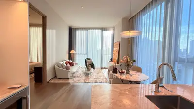 Luxurious open-plan living room with modern decor and stunning city view, perfect for urban living.