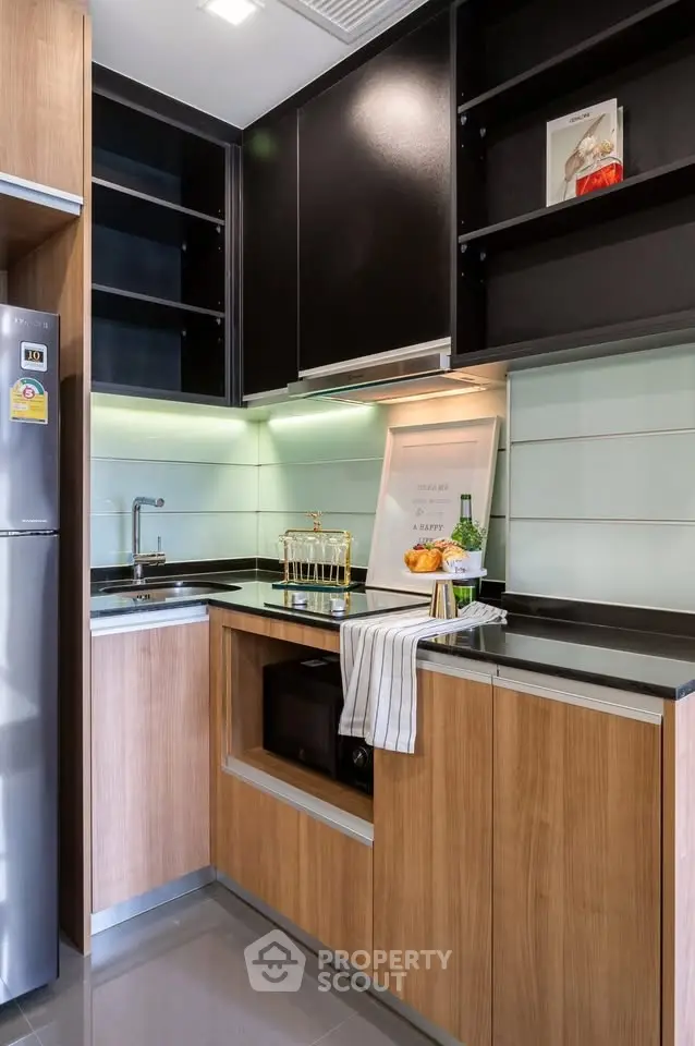 Modern kitchen with sleek cabinetry and built-in appliances