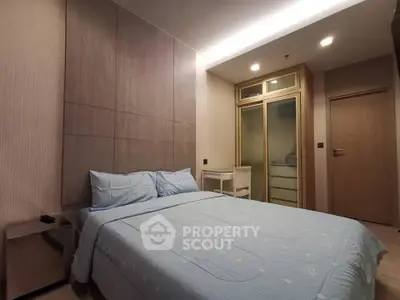 Modern bedroom with stylish design and cozy ambiance, featuring a comfortable bed and elegant decor.