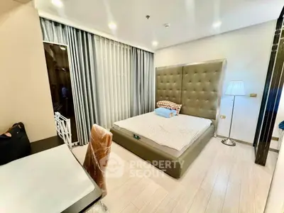 Luxurious bedroom with modern decor and elegant lighting
