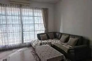 Cozy living room with large windows and comfortable sectional sofa