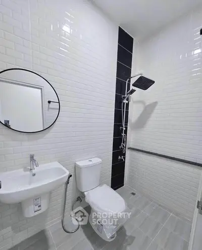 Modern bathroom with sleek shower and white tile design