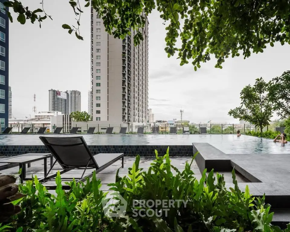 Luxurious urban poolside with cityscape view and lush greenery