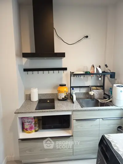 Modern kitchen with sleek cabinetry, built-in appliances, and efficient layout for urban living.