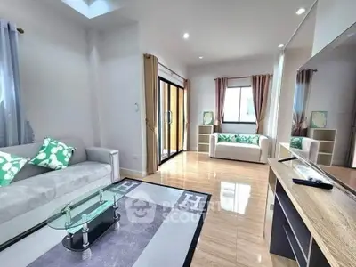 Spacious modern living room with elegant decor and natural light